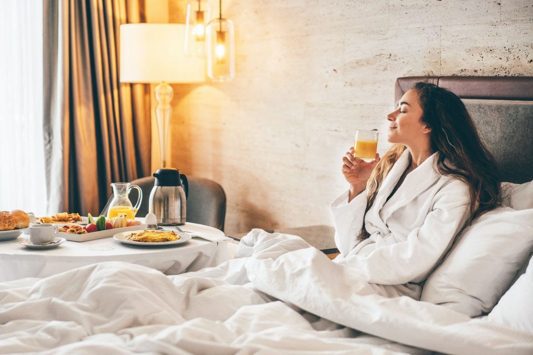 woman-eating-breakfast-in-the-hotel-room-room-service-breakfast-in-hotel-room-1-1.jpg